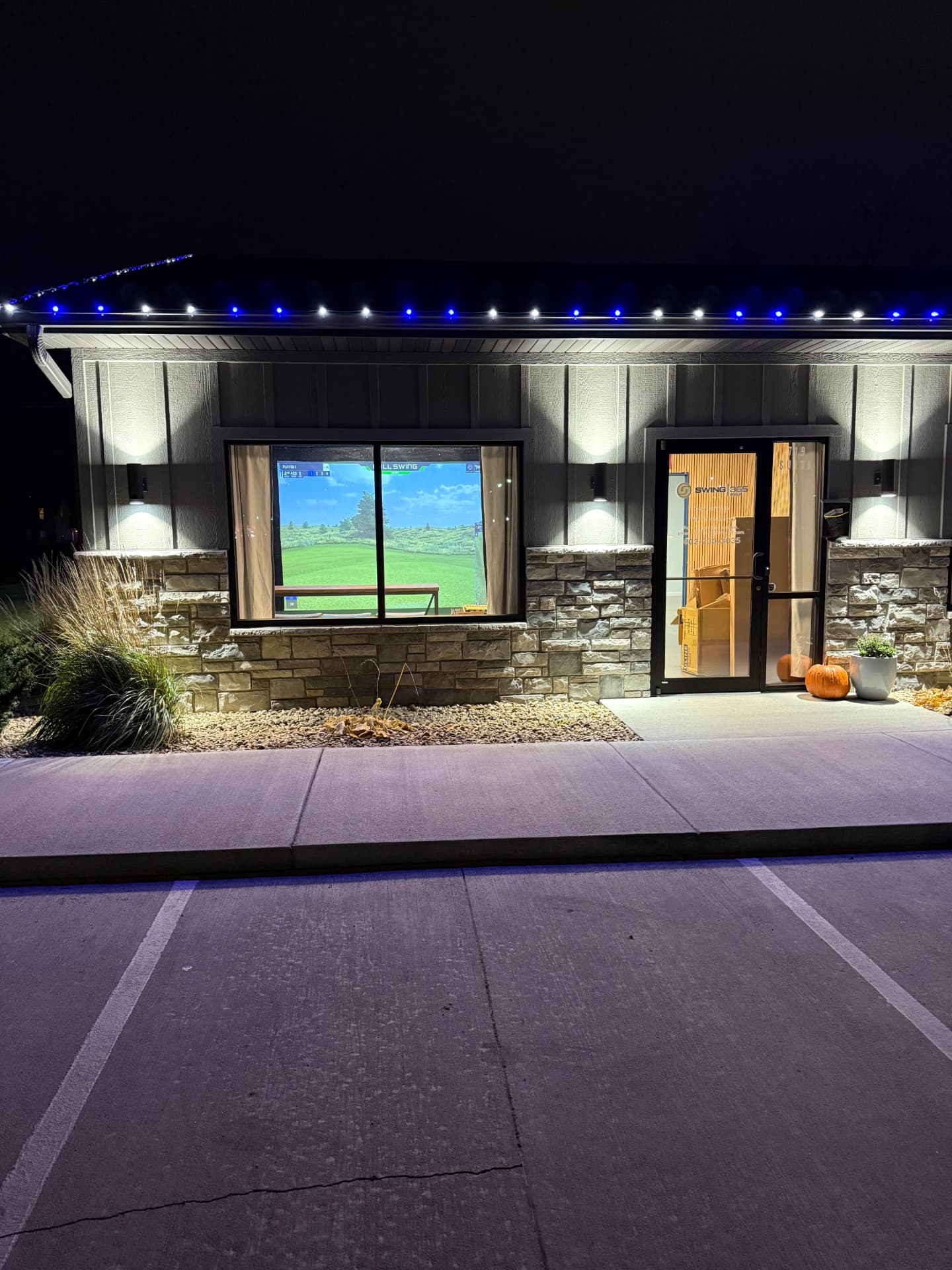 Swing 365 Beatrice exterior at night with simulator visible through the window